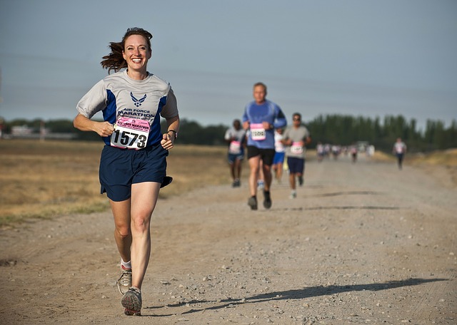 smiling woman running marathon