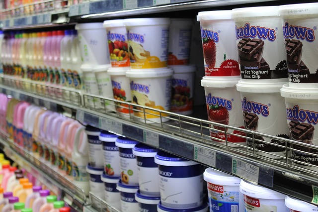 yogurt cups in grocery store dairy case